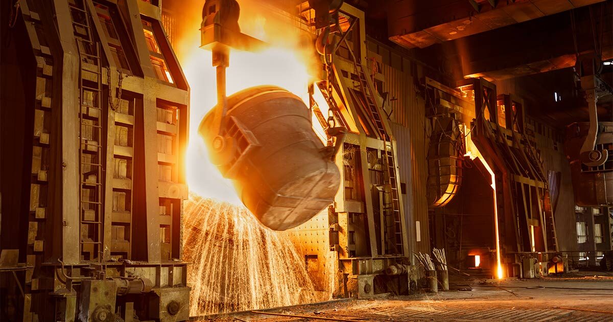 Molten steel ladle pour showering sparks in a steel plant